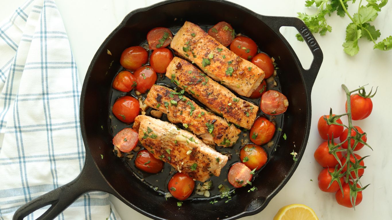 Cast Iron skillet with pan seared lemon garlic salmon